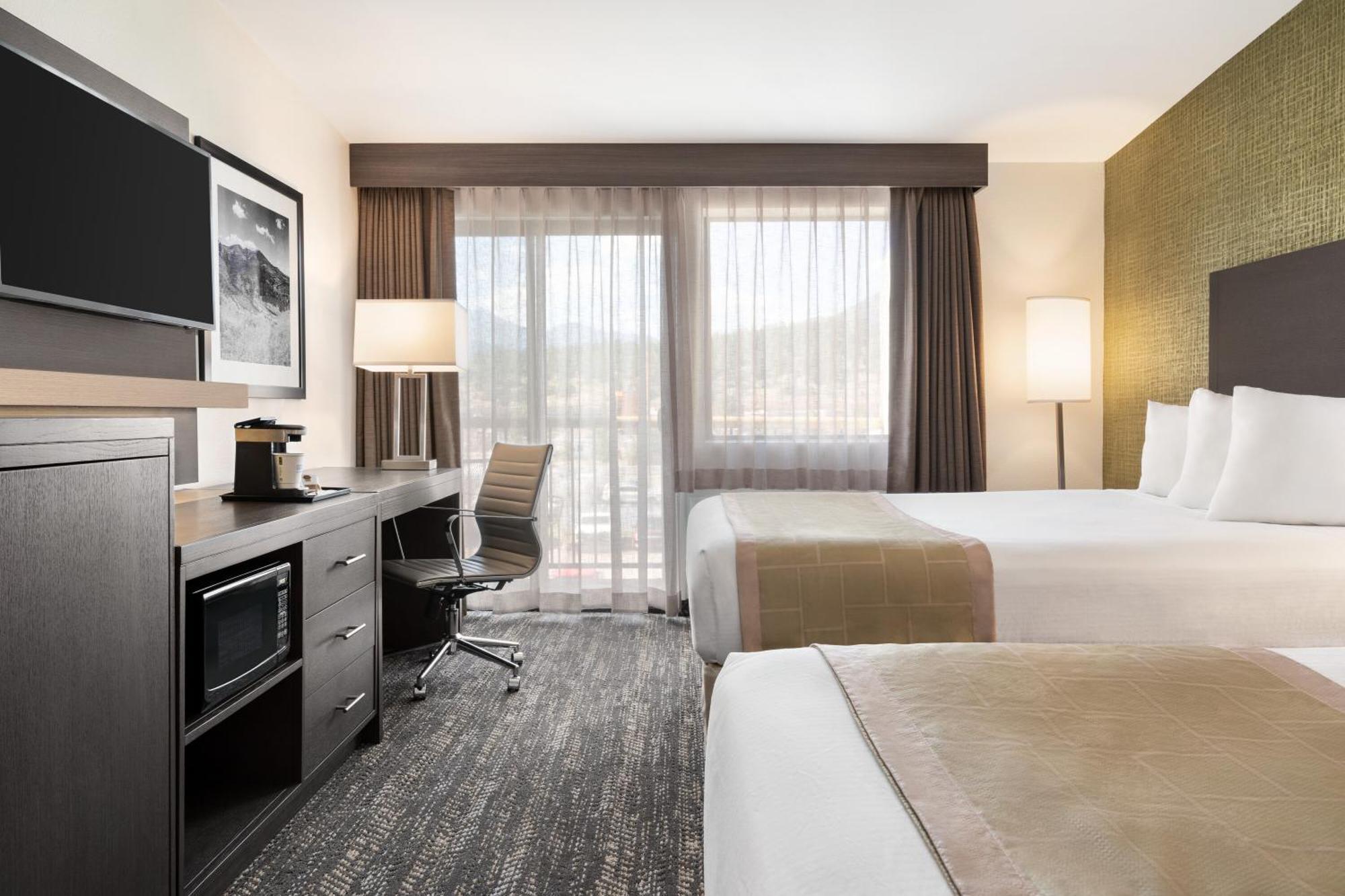 Quadruple Room with Two Queen Beds and Balcony - Non Smoking