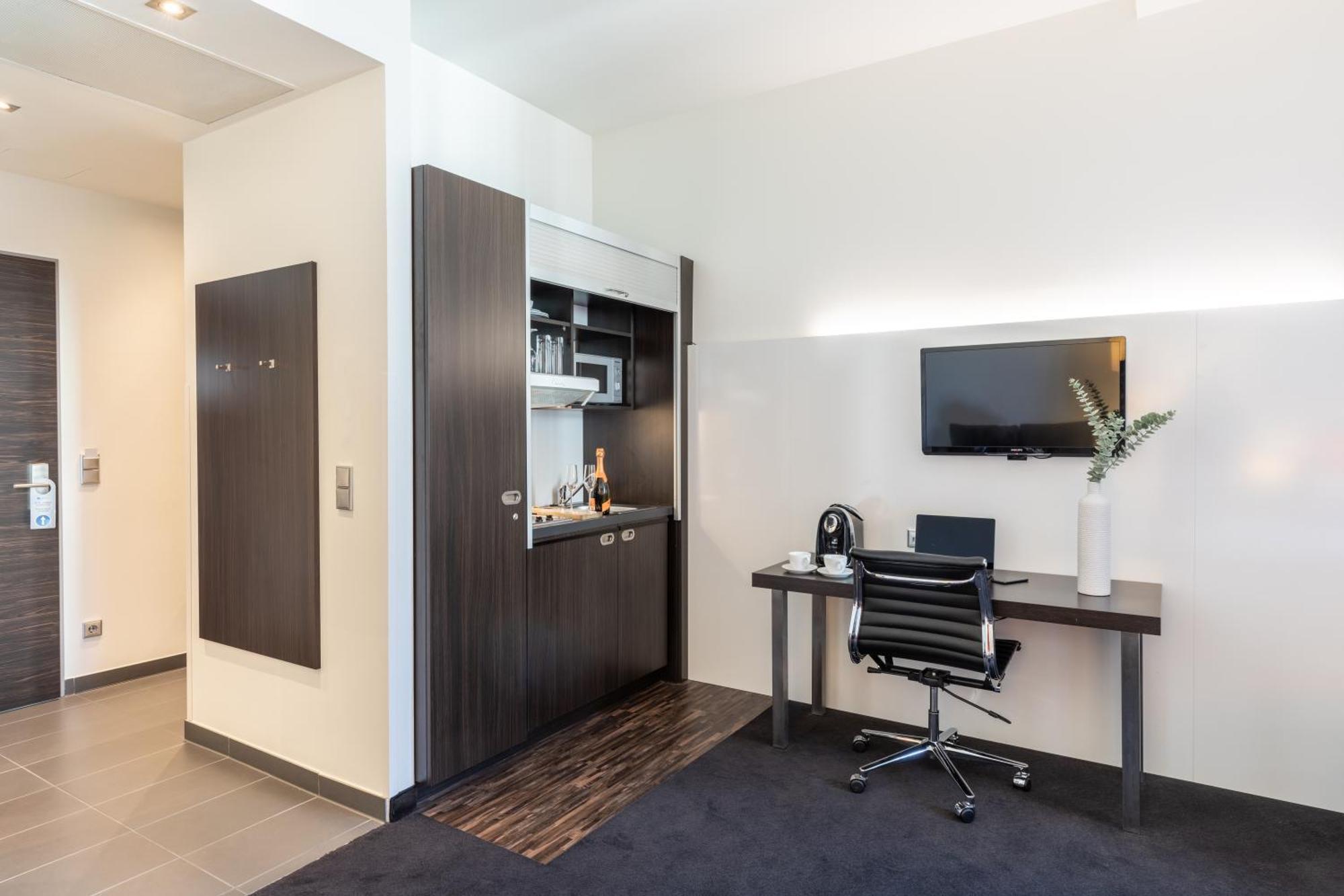 Premium Zimmer mit Queensize-Bett und Küchenzeile