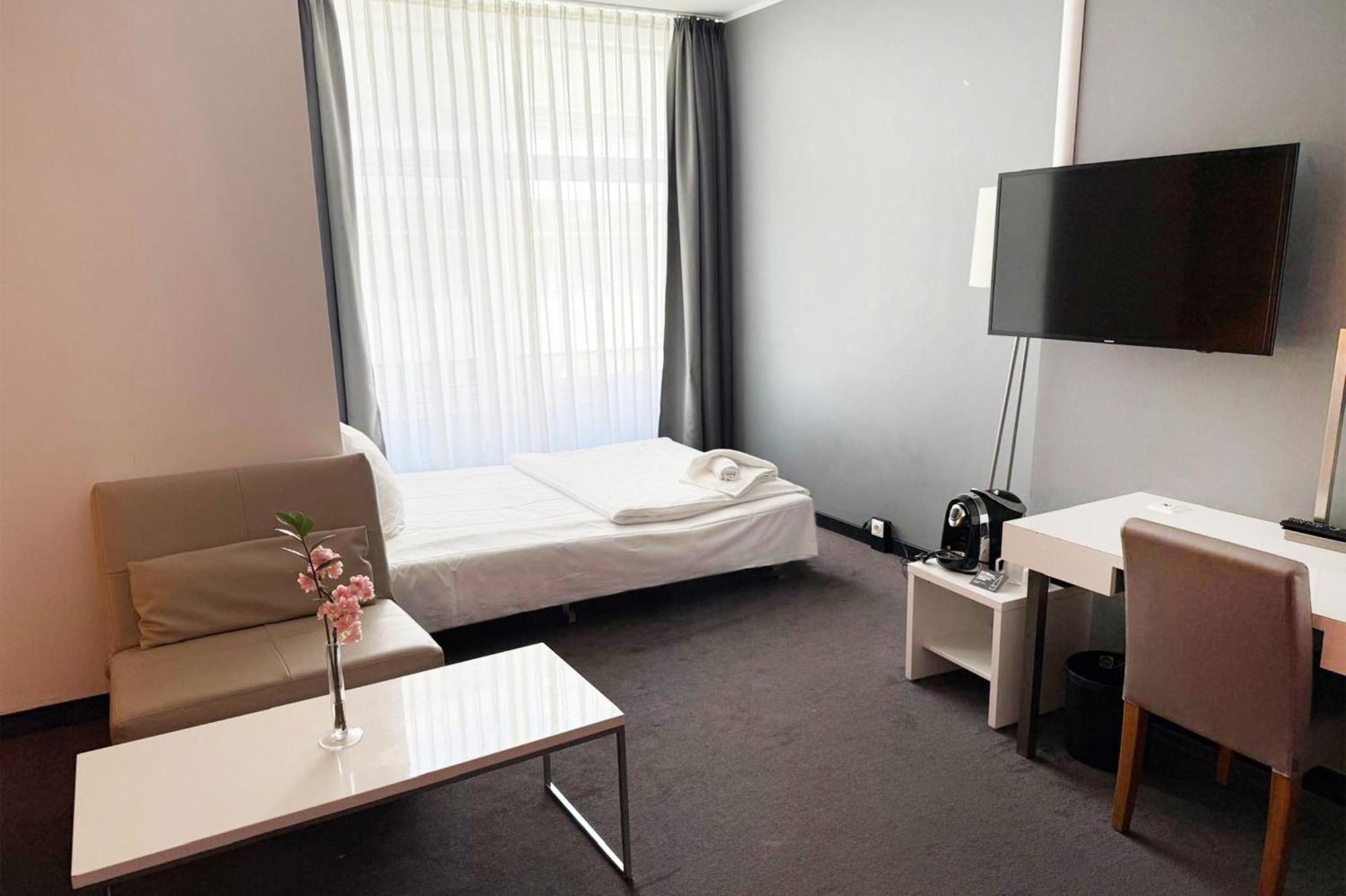 Habitación familiar Premium con cama extragrande y sofá cama