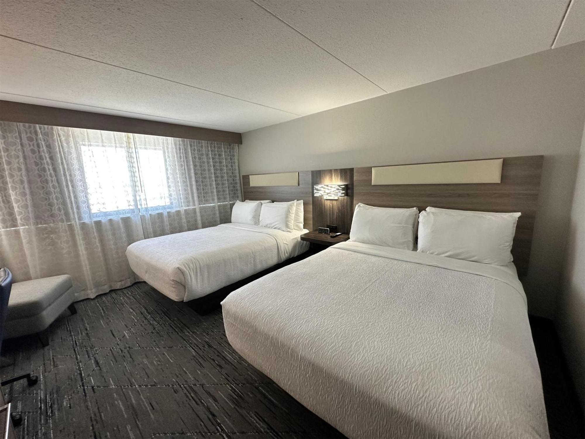 Room with Two Queen Beds and Chair with Ottoman - Non-Smoking,1698917225:JPEG