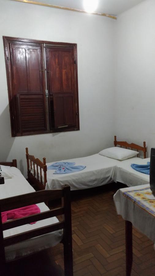 Quarto Triplo com Banheiro Compartilhado